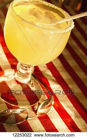 Stock Image - Iced drink and sunglasses; Mazatlan, Mexico. Fotosearch