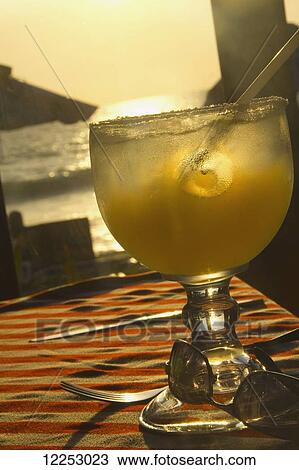 Stock Image - Iced drink and sunglasses; Mazatlan, Mexico. Fotosearch