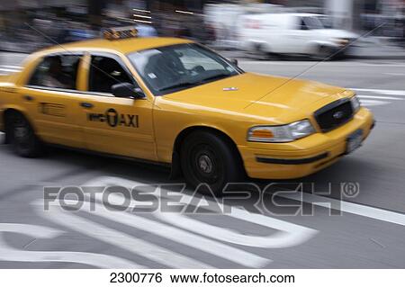 Stock Photograph - Iconic New York City yellow taxi, Manhattan; New York City, New York, United States of America. Fotosearch