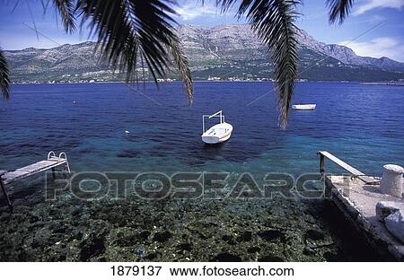 Stock Photo - Idyllic View Of Bay With Crystal-Clear Water. Fotosearch