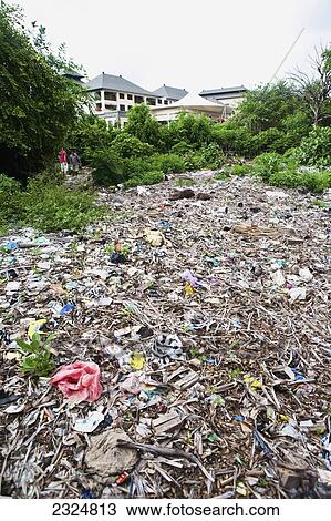 Stock Image - Illegal Trash Dump Behind Resort, Kuta, Bali, Indonesia. Fotosearch