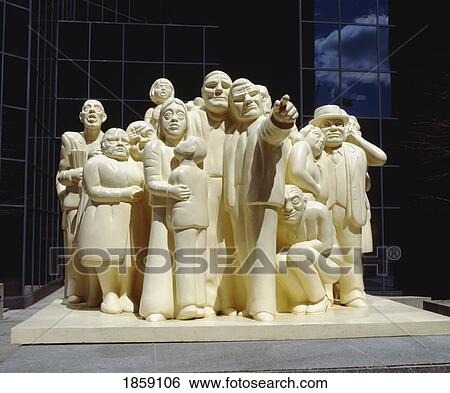 Stock Photograph - Illuminated Crowd Statue In Front Of Bnp Tower, Montreal, Quebec, Canada. Fotosearch