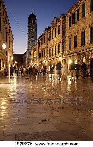 Stock Photograph - Illuminated Old Town Street At Dusk. Fotosearch