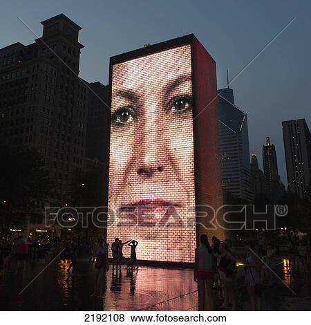 Stock Photo - Image Of A Woman's Face Projected On The Side Of A Building; Chicago Illinois United States Of America. Fotosearch