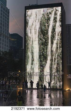 Stock Image - Images Depicted In Light On The Side Of The Crown Fountain; Chicago Illinois United States Of America. Fotosearch