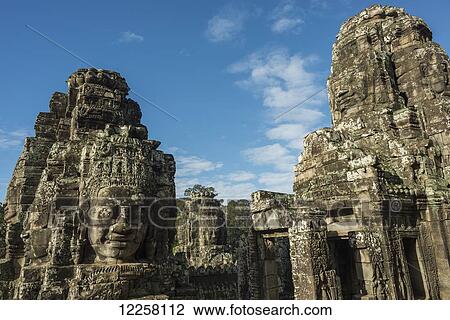 Impressive Buddha's faces in Bayon Wat, built by the king Jayavarman VII in the end of twelfth century, from Angkor; Siem Reap, Cambodia View Large Photo Image Stock Image - Impressive Buddha's faces in Bayon Wat, built by the king Jayavarman VII in the end of twelfth century, from Angkor; Siem Reap, Cambodia. Fotosearch