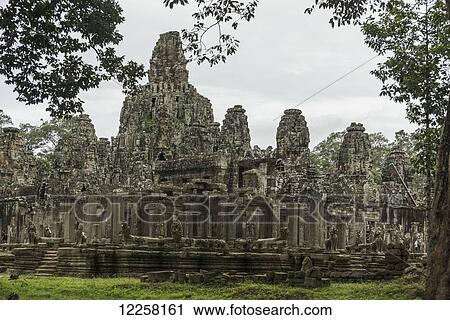 Impressive Buddha's faces in Bayon Wat, built by the king Jayavarman VII in the end of twelfth century, from Angkor; Siem Reap, Cambodia View Large Photo Image Stock Image - Impressive Buddha's faces in Bayon Wat, built by the king Jayavarman VII in the end of twelfth century, from Angkor; Siem Reap, Cambodia. Fotosearch