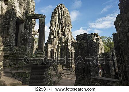 Stock Image - Impressive Buddha's faces in Bayon Wat, built by the king Jayavarman VII in the end of twelfth century, from Angkor; Siem Reap, Cambodia. Fotosearch