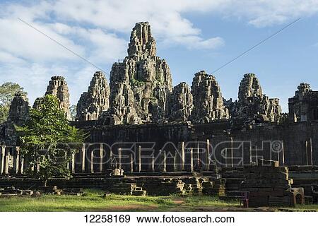 Impressive Buddha's faces in Bayon Wat, built by the king Jayavarman VII in the end of twelfth century, from Angkor; Siem Reap, Cambodia View Large Photo Image Stock Photo - Impressive Buddha's faces in Bayon Wat, built by the king Jayavarman VII in the end of twelfth century, from Angkor; Siem Reap, Cambodia. Fotosearch