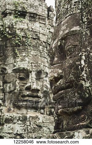 Impressive Buddha's faces in Bayon Wat, built by the king Jayavarman VII in the end of the 12th Century, from Angkor; Siem Reap, Cambodia View Large Photo Image Stock Photograph - Impressive Buddha's faces in Bayon Wat, built by the king Jayavarman VII in the end of the 12th Century, from Angkor; Siem Reap, Cambodia. Fotosearch