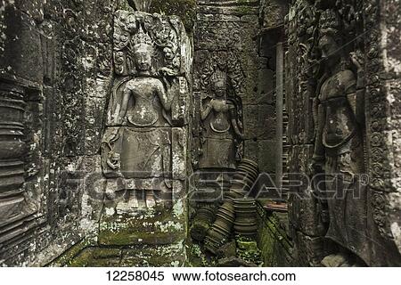 Impressive Buddha's faces in Bayon Wat, built by the king Jayavarman VII in the end of the 12th Century, from Angkor; Siem Reap, Cambodia View Large Photo Image Stock Photography - Impressive Buddha's faces in Bayon Wat, built by the king Jayavarman VII in the end of the 12th Century, from Angkor; Siem Reap, Cambodia. Fotosearch