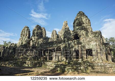 Impressive Buddha's faces in Bayon Wat, built by the king Jayavarman VII in the end of the twelfth century, from Angkor; Siem Reap, Cambodia View Large Photo Image Stock Photography - Impressive Buddha's faces in Bayon Wat, built by the king Jayavarman VII in the end of the twelfth century, from Angkor; Siem Reap, Cambodia. Fotosearch