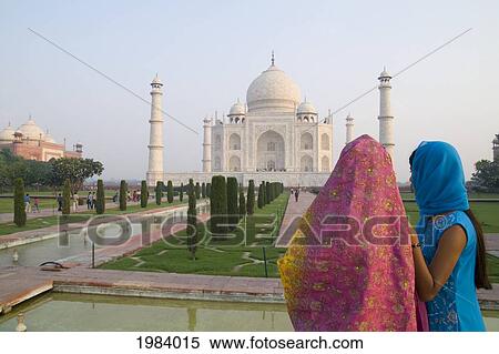 India, Agra, Hindu Women Wearing Colorful Sari And Viels Looking At The Taj Mahal. View Large Photo Image Stock Photography - India, Agra, Hindu Women Wearing Colorful Sari And Viels Looking At The Taj Mahal.. Fotosearch