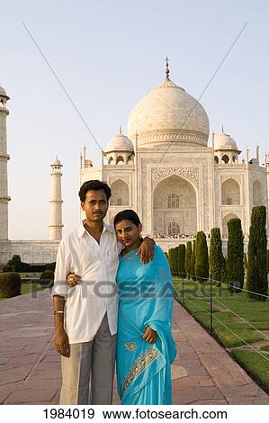 Stock Photo - India, Agra, Local Hindu Couple Pose In Front Of The Taj Mahal.. Fotosearch