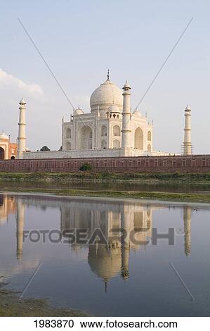 Stock Image - India, Agra, Taj Mahal, Temple Burial Site At Sunset From Yamuna River.. Fotosearch