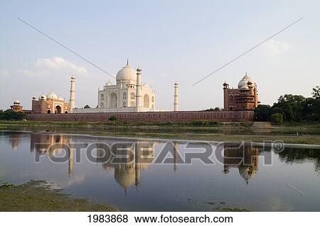 Stock Photo - India, Agra, Taj Mahal, Temple Burial Site At Sunset From Yamuna River.. Fotosearch