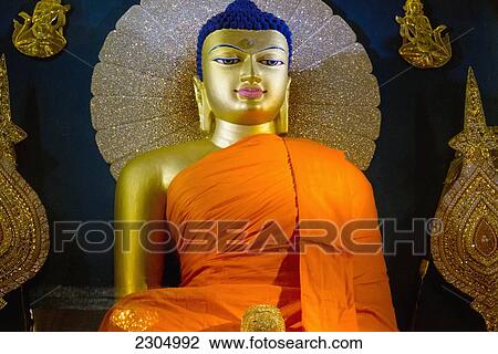 Stock Image - India, Bihar, Statue of Shakymuni Buddha inside the Mahabodhi Temple; Bodhgaya. Fotosearch