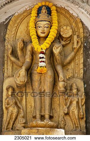 Stock Image - India, Bihar, Statue of White Tara at Mahabodhi Temple; Bodhgaya. Fotosearch