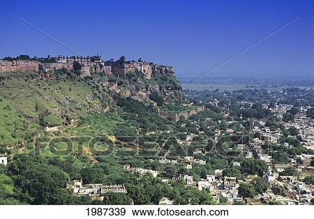 India, City Of Gwalior, Man Singh Palace On Hillside Above, Clear Blue Skies. View Large Photo Image Stock Photo - India, City Of Gwalior, Man Singh Palace On Hillside Above, Clear Blue Skies.. Fotosearch