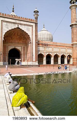 India, Delhi, Jama Masjid, Women Worship At Water Within The Largest Mosque In The Country. View Large Photo Image Stock Image - India, Delhi, Jama Masjid, Women Worship At Water Within The Largest Mosque In The Country.. Fotosearch