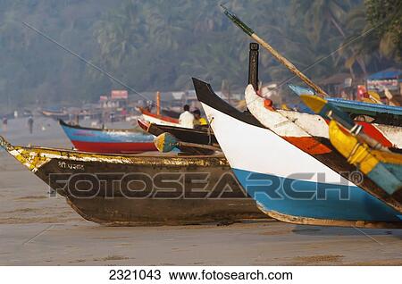 Stock Image - India, Fishing Boat At Sunset On Palolem Beach; Goa. Fotosearch