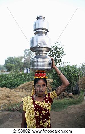 India, Gujurat State, Girl Holding Milk Pots On Head; Ahmedabad City View Large Photo Image Stock Image - India, Gujurat State, Girl Holding Milk Pots On Head; Ahmedabad City. Fotosearch