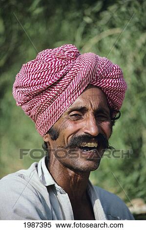 India, Headshot Of Smiling Rajasthan Man, Wearing Red And White Striped Turban. View Large Photo Image Stock Photography - India, Headshot Of Smiling Rajasthan Man, Wearing Red And White Striped Turban.. Fotosearch