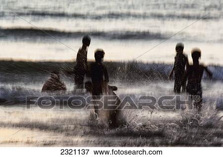 India, Karnataka, Blurry Figures In Crashing Waves At Gokarna Beach; Gokarna View Large Photo Image Stock Photo - India, Karnataka, Blurry Figures In Crashing Waves At Gokarna Beach; Gokarna. Fotosearch