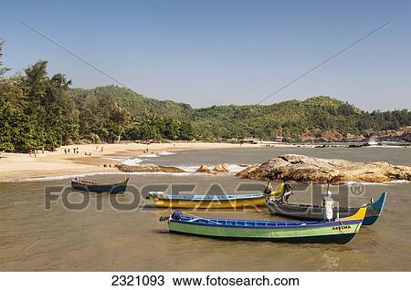 Stock Image - India, Karnataka, Fishing Boats On Kudle And Om Beaches; Gokarna. Fotosearch