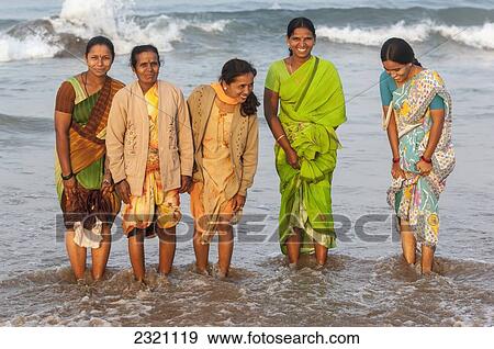 India, Karnataka, Group Of Indian Women Posing Ankle Deep In Water; Gokarna View Large Photo Image Stock Photo - India, Karnataka, Group Of Indian Women Posing Ankle Deep In Water; Gokarna. Fotosearch