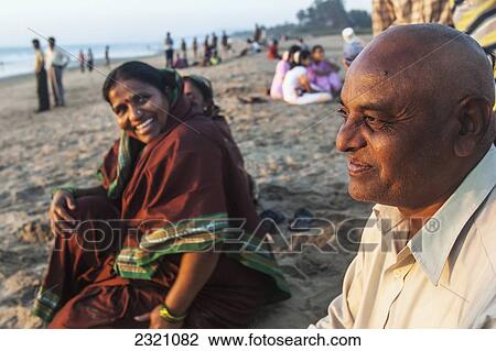 Stock Image - India, Karnataka, Indian Man And His Family; Gokarna Beach. Fotosearch