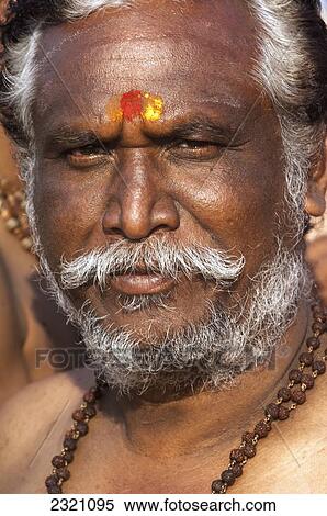 Stock Photography - India, Karnataka, Portrait Of Man With Necklace; Gokarna. Fotosearch