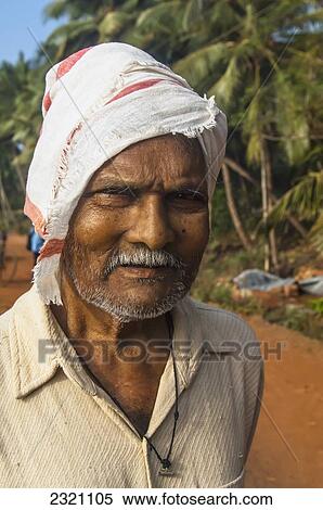 India, Karnataka, Portrait Of Senior Man On Dirt Road; Gokarna View Large Photo Image Stock Photography - India, Karnataka, Portrait Of Senior Man On Dirt Road; Gokarna. Fotosearch