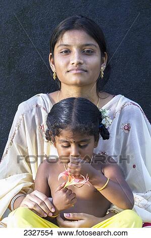 India, Little Andaman Island, Portrait of Indian Hindu woman and child at bas of Richardson's lighthouse; Hut Bay View Large Photo Image Picture - India, Little Andaman Island, Portrait of Indian Hindu woman and child at bas of Richardson's lighthouse; Hut Bay. Fotosearch
