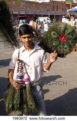 India, Rajasthan, Jaipur, Boy Selling Peacock Feathers In Downtown Center Of The Pink City. View Large Photo Image Stock Image - India, Rajasthan, Jaipur, Boy Selling Peacock Feathers In Downtown Center Of The Pink City.. Fotosearch