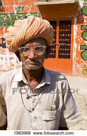 India, Rajasthan, Jodhpur, Portrait Of A Hindu Man Wearing Glasses And Turban. View Large Photo Image Stock Photo - India, Rajasthan, Jodhpur, Portrait Of A Hindu Man Wearing Glasses And Turban.. Fotosearch