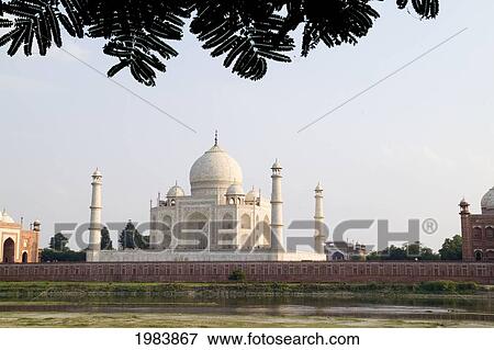 Stock Photo - India, Temple burial site seen from Yamuna River at sunset; Agra, Taj Mahal. Fotosearch