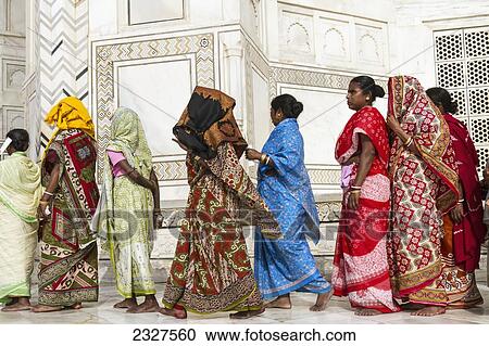 Stock Image - India, Uttar Pradesh, Side view of people waiting to enter Taj Mahal; Agra. Fotosearch