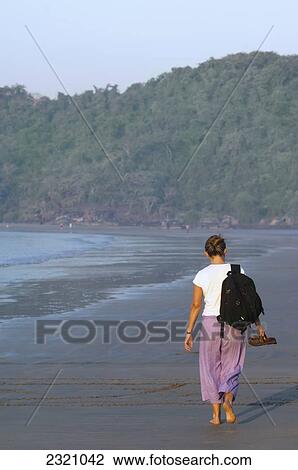 Stock Image - India, Walking On Palolem Beach; Goa. Fotosearch