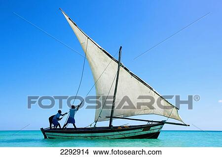 Picture - Indian Ocean, Men sailing dhow; Mozambique. Fotosearch