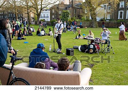 Indie Band Playing For A Trendy Crowd In London Fields, Shoreditch, London, Uk View Large Photo Image Stock Photo - Indie Band Playing For A Trendy Crowd In London Fields, Shoreditch, London, Uk. Fotosearch