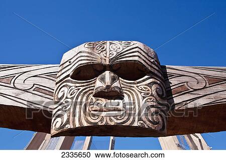 Stock Image - Indigenous Totem Of Native Face; New Zealand. Fotosearch