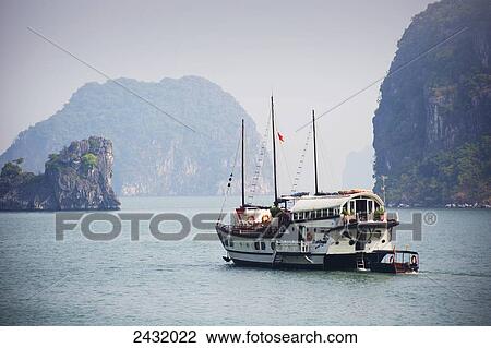 Indochina junk in Bai Tu Long Bay in Halong Bay, Gulf of Tonkin; Cam Pha district, Vietnam View Large Photo Image Stock Image - Indochina junk in Bai Tu Long Bay in Halong Bay, Gulf of Tonkin; Cam Pha district, Vietnam. Fotosearch