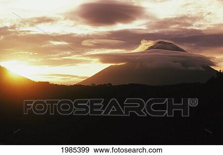 Stock Photo - Indonesia, Bali, Abang and Agung mountain peaks at sunset; Lake Batur. Fotosearch