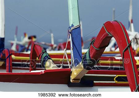 Stock Image - Indonesia, Bali, Detail Of Outrigger Canoe In Harbor.. Fotosearch