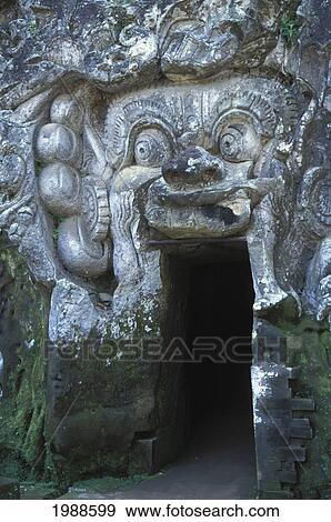 Indonesia, Bali, Goa Gajah Elephant Cave, Stone Carvings Into Wall, Doorway Covered With Moss View Large Photo Image Stock Photo - Indonesia, Bali, Goa Gajah Elephant Cave, Stone Carvings Into Wall, Doorway Covered With Moss. Fotosearch