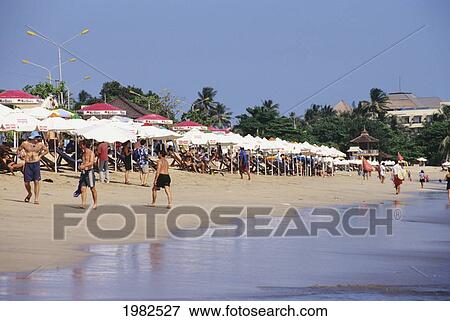 Stock Photo - Indonesia, Bali, Kuta Beach, Umbrellas line the famous surf beach. Fotosearch