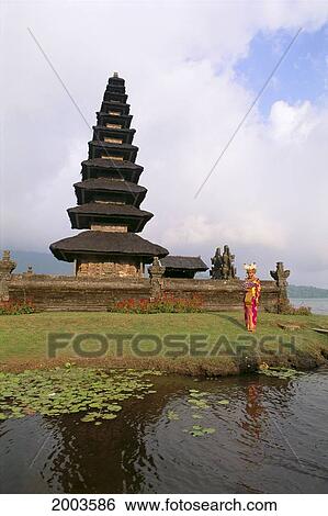 Indonesia, Bali, Lake Bratan Bride In Traditional Costume Stands In Front Of Temple View Large Photo Image Stock Photograph - Indonesia, Bali, Lake Bratan Bride In Traditional Costume Stands In Front Of Temple. Fotosearch