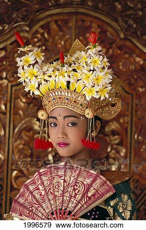 Stock Photo - Indonesia, Bali, Legong Dancer Young Girl In Traditional Costume, Holding Fan A61C. Fotosearch