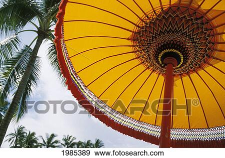 Indonesia, Bali, Nusa Dua Hotel, View From Below Of Yellow Patio Umbrella. View Large Photo Image Stock Photo - Indonesia, Bali, Nusa Dua Hotel, View From Below Of Yellow Patio Umbrella.. Fotosearch